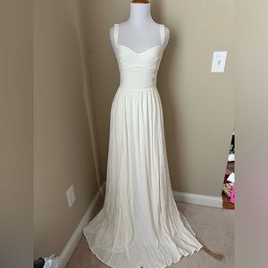 NWT Reformation Hollyhock dress in cream size 2. Unworn and in perfect condition